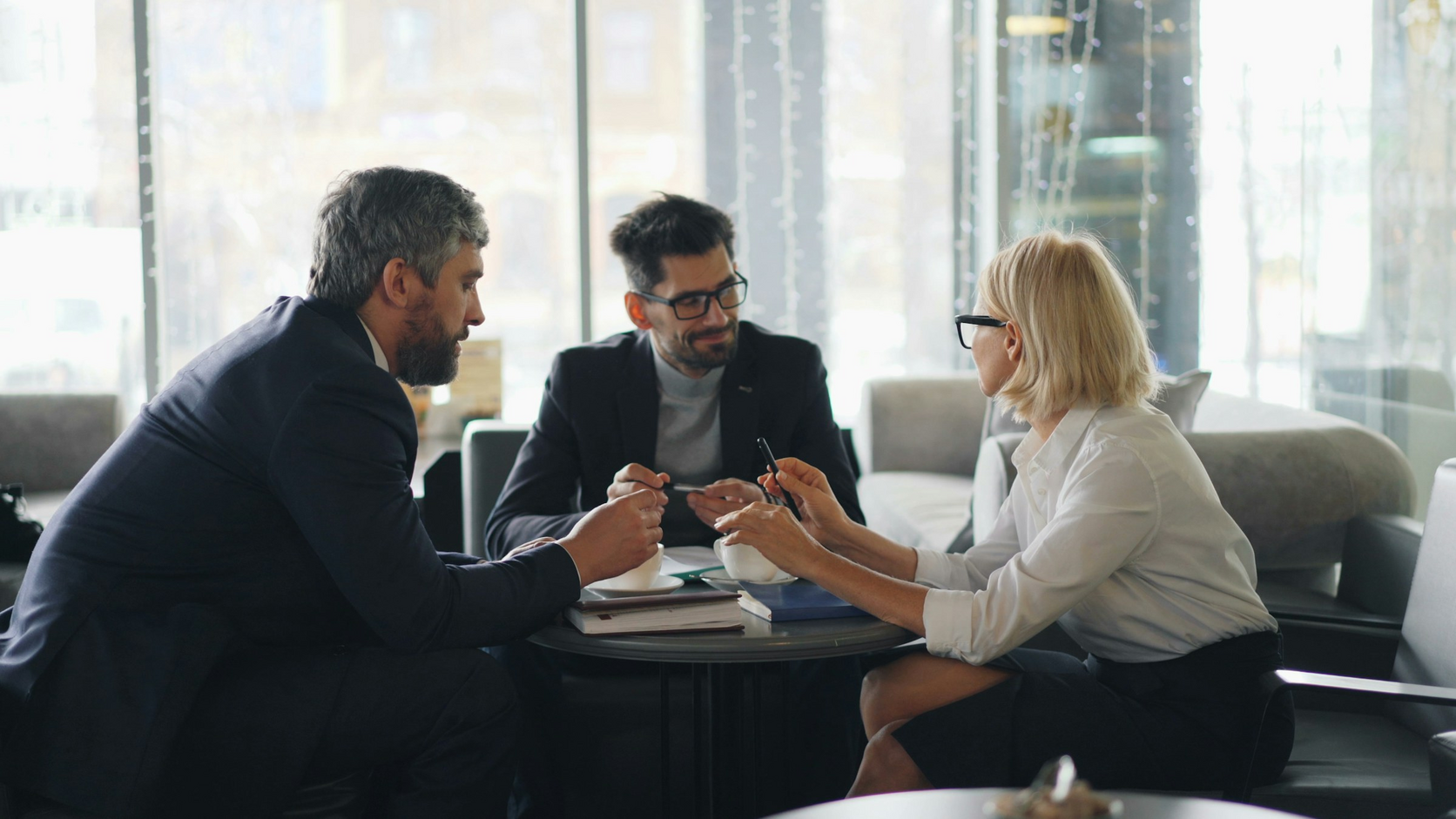A small local service team preparing together around a table
